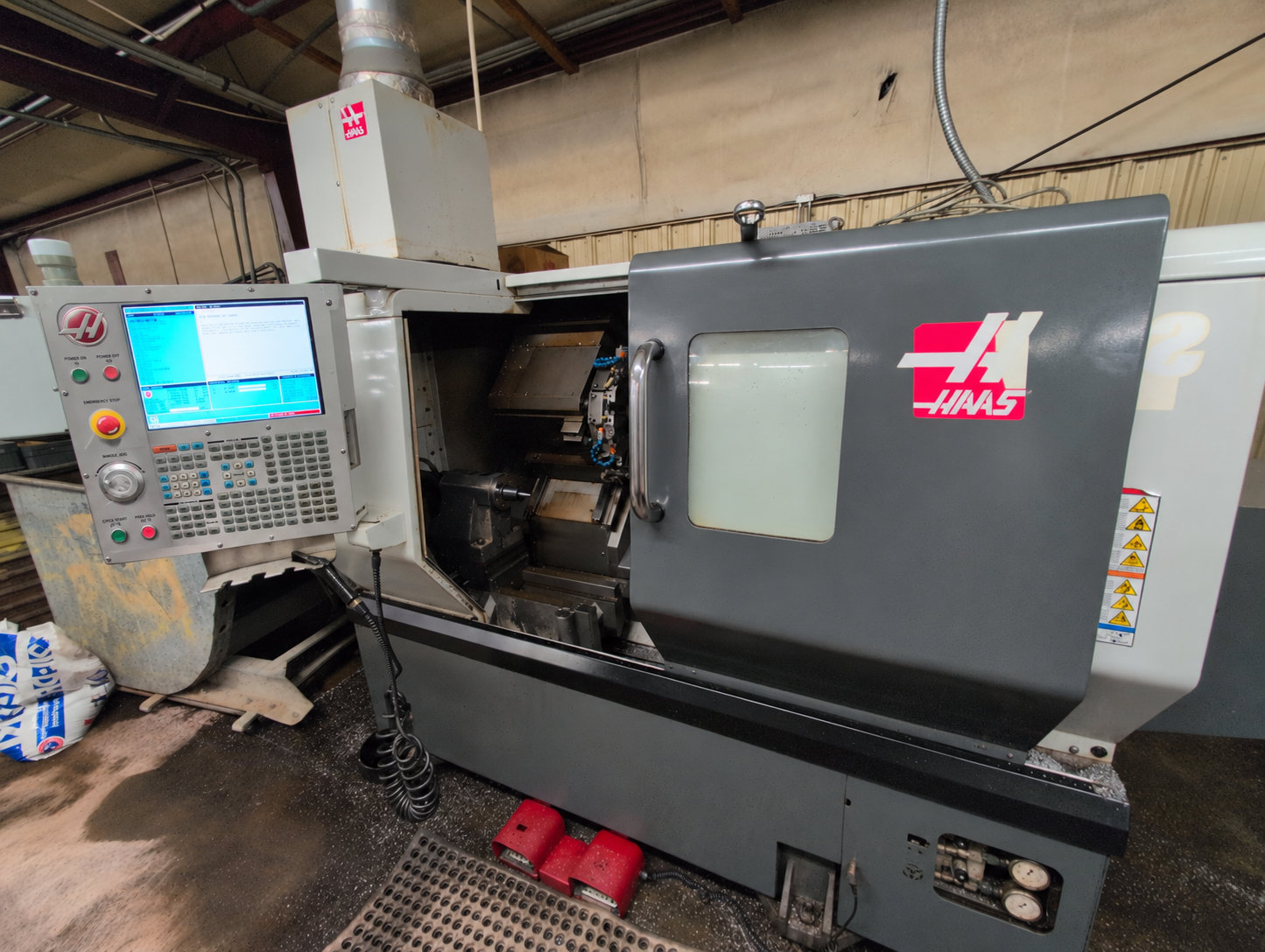 A second Haas CNC lathe shown from the opposing angle